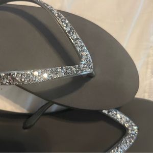 Reef Black Starlight flip flops